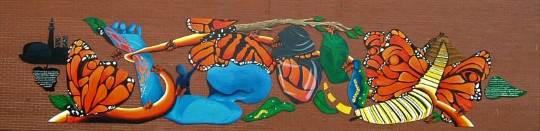 A mural affixed to a wall depicting the stages of life for a monarch butterfly, surrounded by an image of a blue human with an extended hand, and the Toronto city skyline to the left.