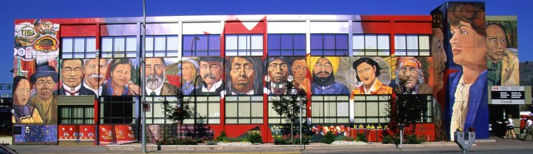 A mural depicting seventeen individuals of differing backgrounds.