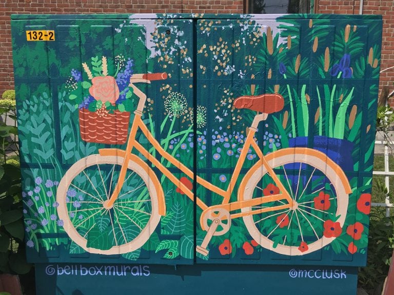 Bike Leaning Against Garden Fence