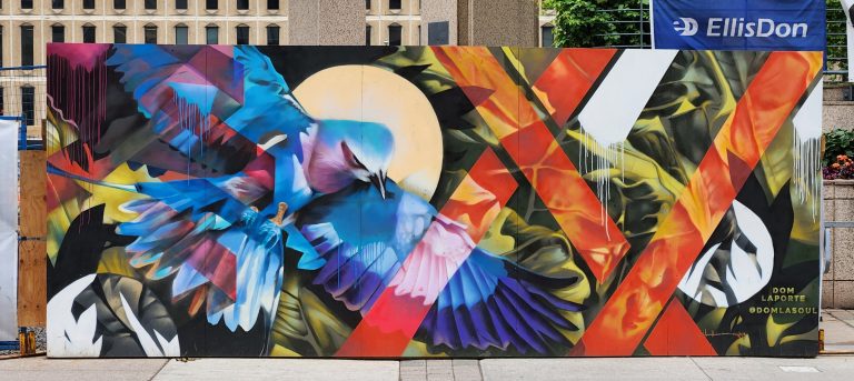 Blue bird over foliage with red stripes