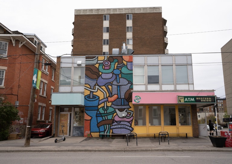 Merge of coffee cups, tea pots with straws, and large coffee beans. Right bottom corner labeled "TAVUKCIYAN"