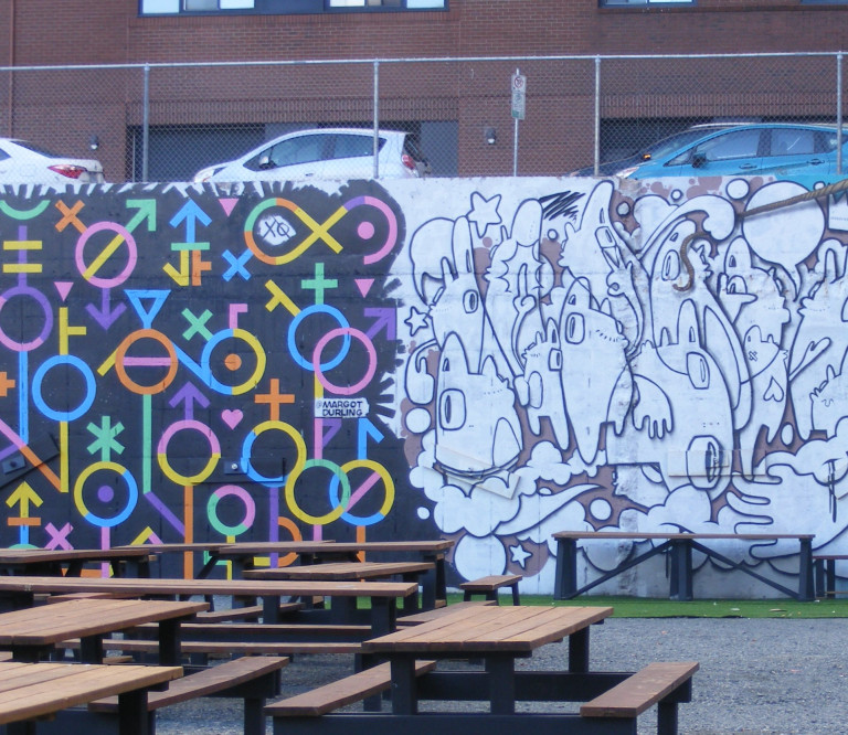 Multi-coloured venus and mars symbols are set against a black background.