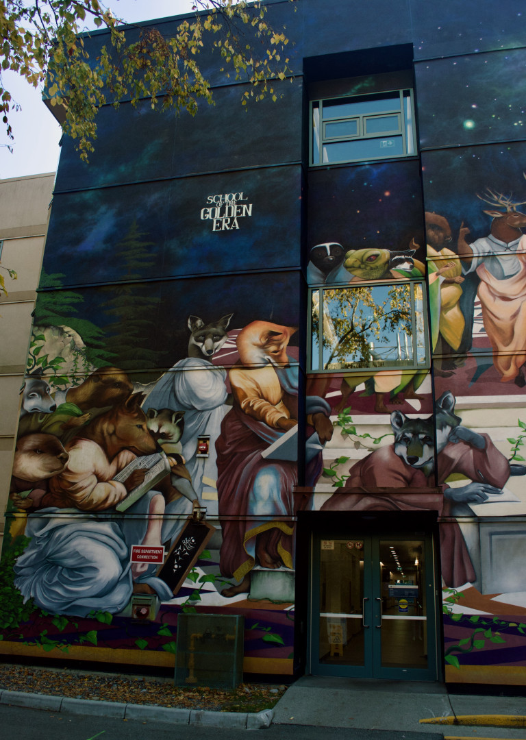 A vertical wall depicting the famous renaissance painting of Plato and Aristotle but with animals instead of humans