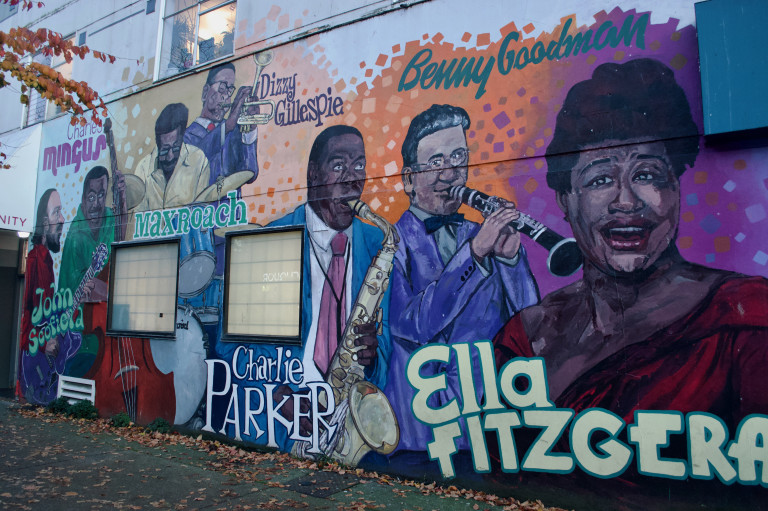 Vertical wall mural of jazz artists.