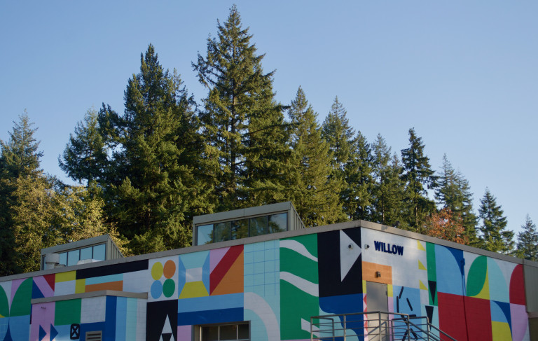 The colourful geometric shapes and abstract forms give life to the brutalist architecture.