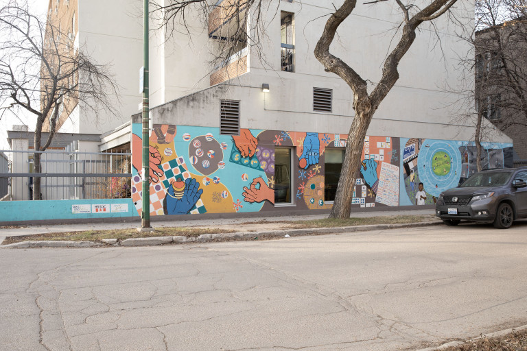 A brighly coloured scene with multicoloured hands that play different board games such as dominoes, tic tac toe, marbles, mancala, jacks and other games.