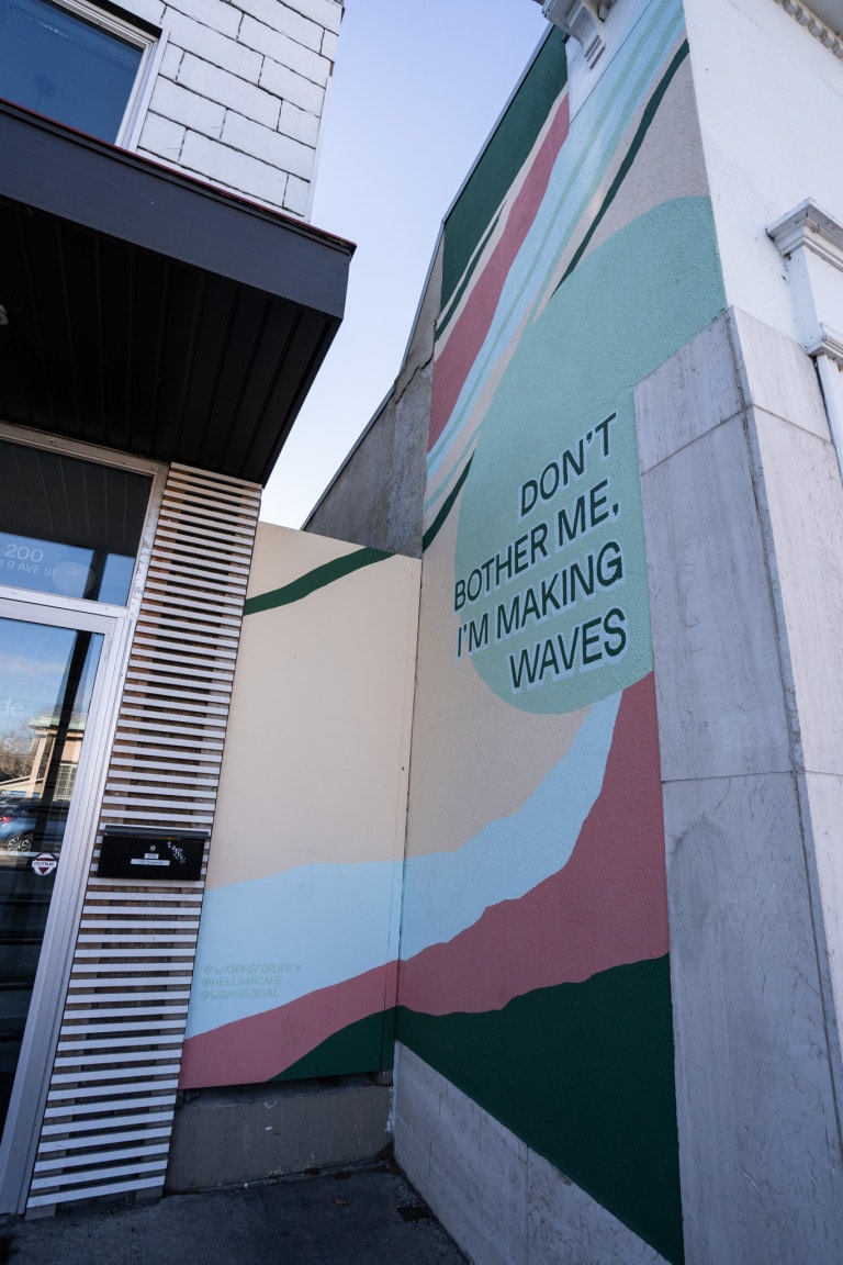 Text reads: "DON'T BOTHER ME. I'M MAKING WAVES" with abstract lines and circle in background