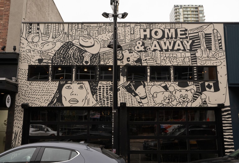 From left to right. Deer, bear wearing cowboy hat, portrait of lady below, hockey player and two small bears holding a Canadian flag. Building city landscape in background.  'Home & Away' text in block letters on right side.