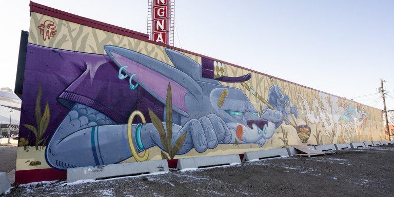 From left to right. Pierced cat using chopsticks on soup where a dragon-like figure comes out spreading out across the right side of the wall.