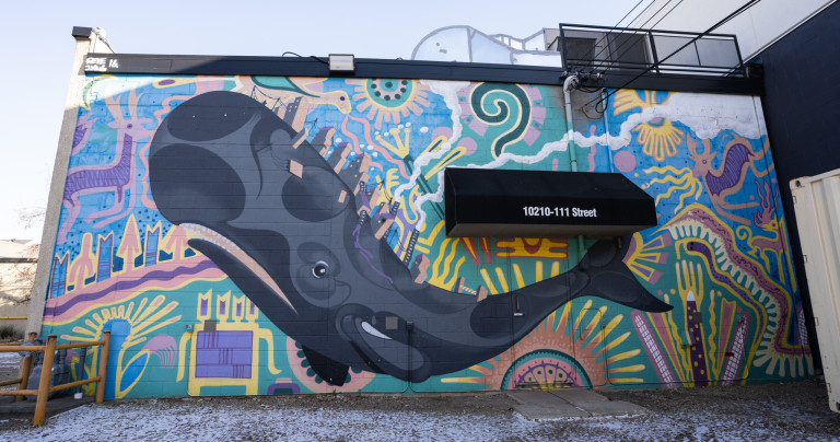 Whale amidst a background of abstract shapes and lines