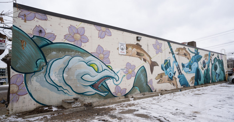 Left to right. Big fish out of water along to show perspective and farther away fish. Fox and bear shown fishing using a fishing rod.
