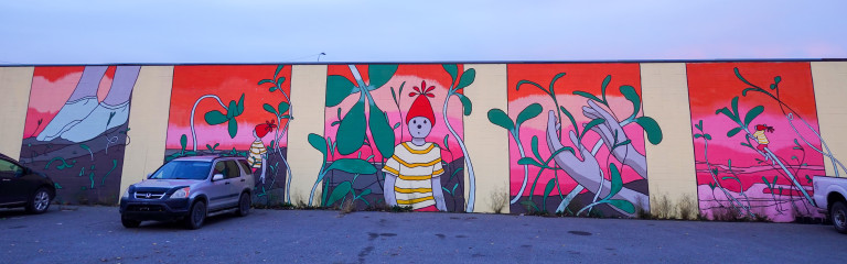 A five panel mural following a person walking through a garden of saplings. The person shrinks to find themselves wandering through the saplings which are now the size of trees that they climb.